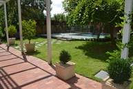 Red Brick verandah and Buffalo Lawn