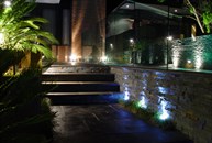 View of steps and planter boxes at night