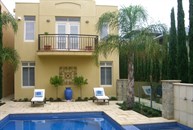 View of Pool and Tuscan inspired house