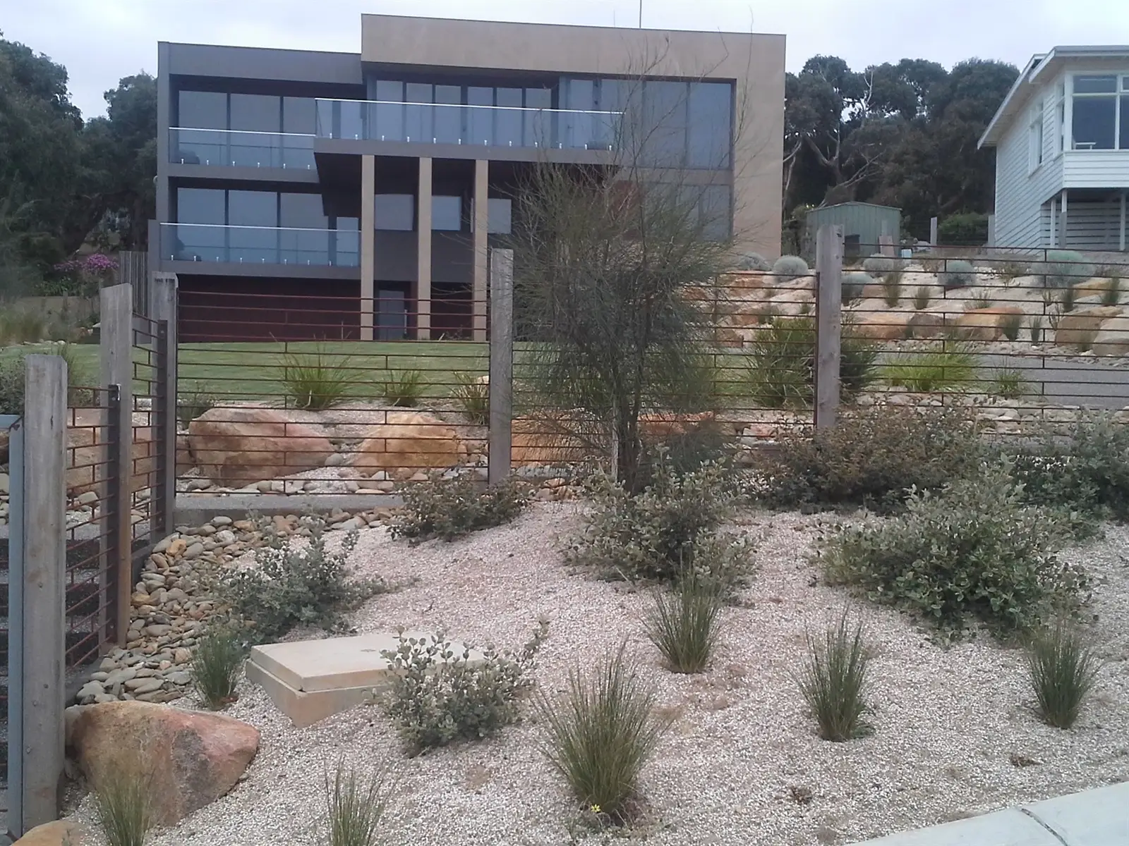 View of coastal garden and driveway plantings